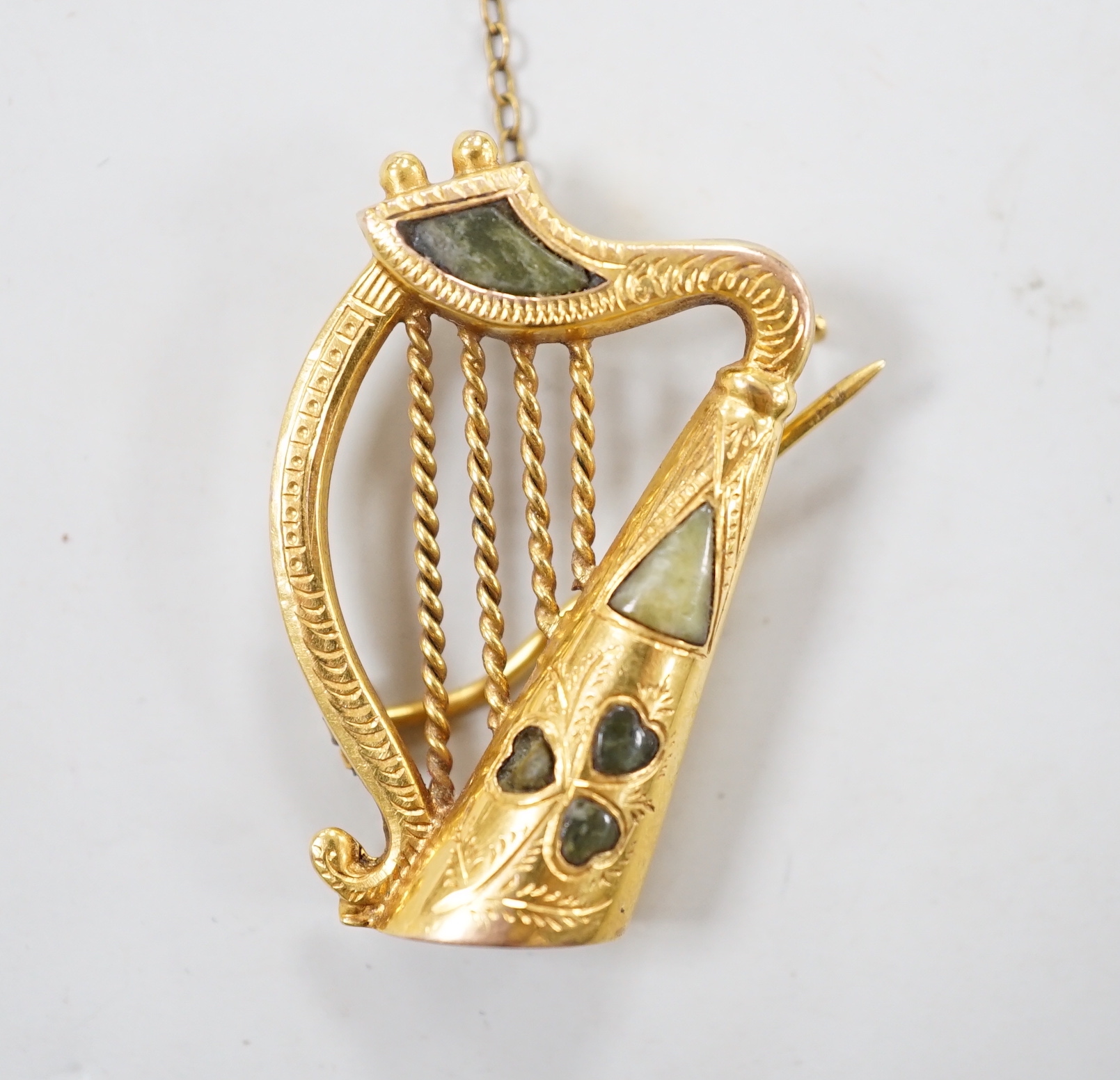 A George V 9ct gold and inset hardstone set brooch, modelled as a harp, 34mm, gross weight 5.6 grams.